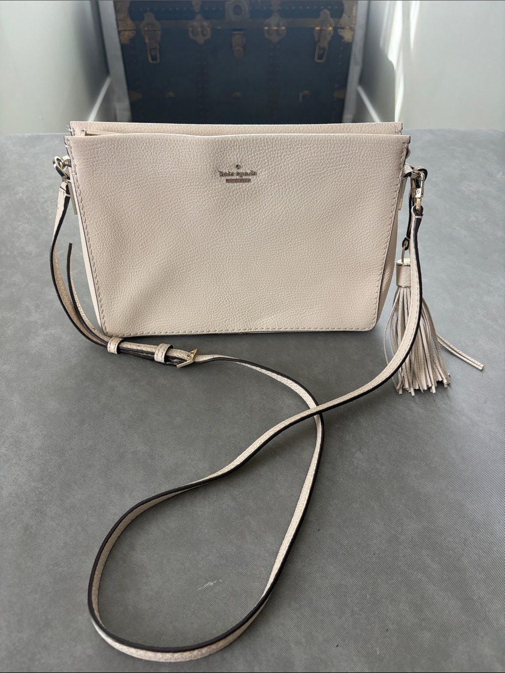 Kate Spade Cream Pebbled Leather Crossbody in Bag with Tassel
